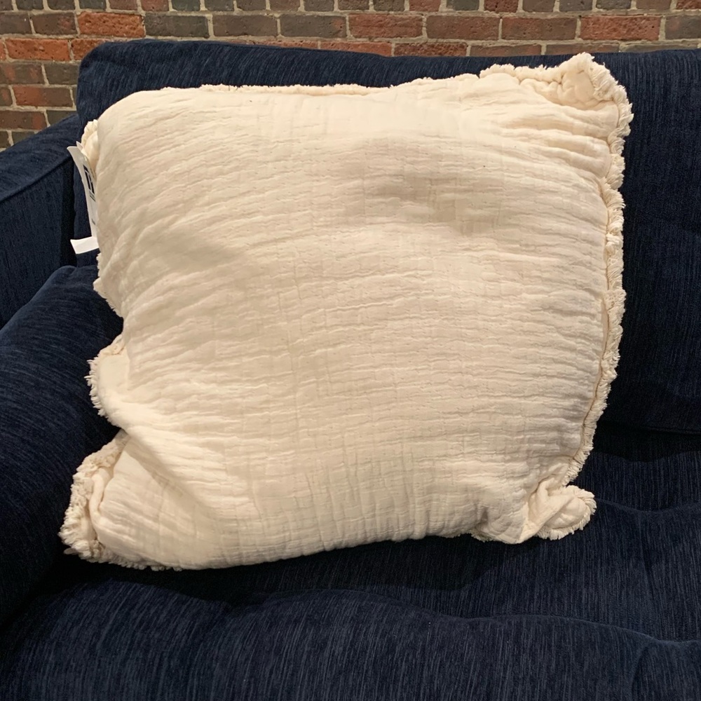 Cream throw pillow